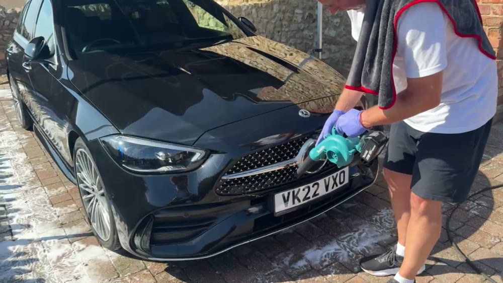 Careful hand finishing around the front of a Mercedes during a Yarty Valet clean
