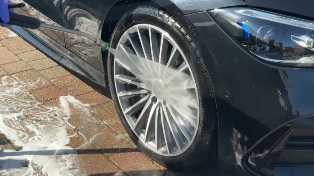 A Mercedes alloy wheel being thoroughly rinsed during a Yarty Valet clean